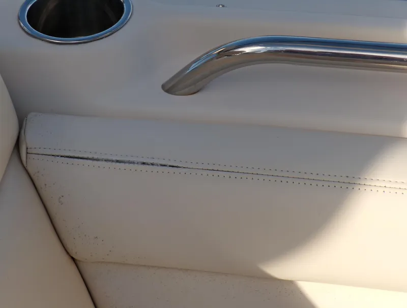 Slide: The Image of Grady-White Freedom 275 boat interior, 2016 model, featuring white upholstery and stainless steel handle. - 41