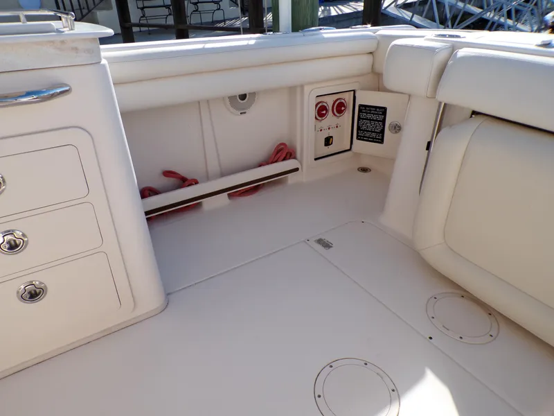Slide: The Image of 2016 Grady-White Freedom 275 boat interior with storage compartments and seating. - 49