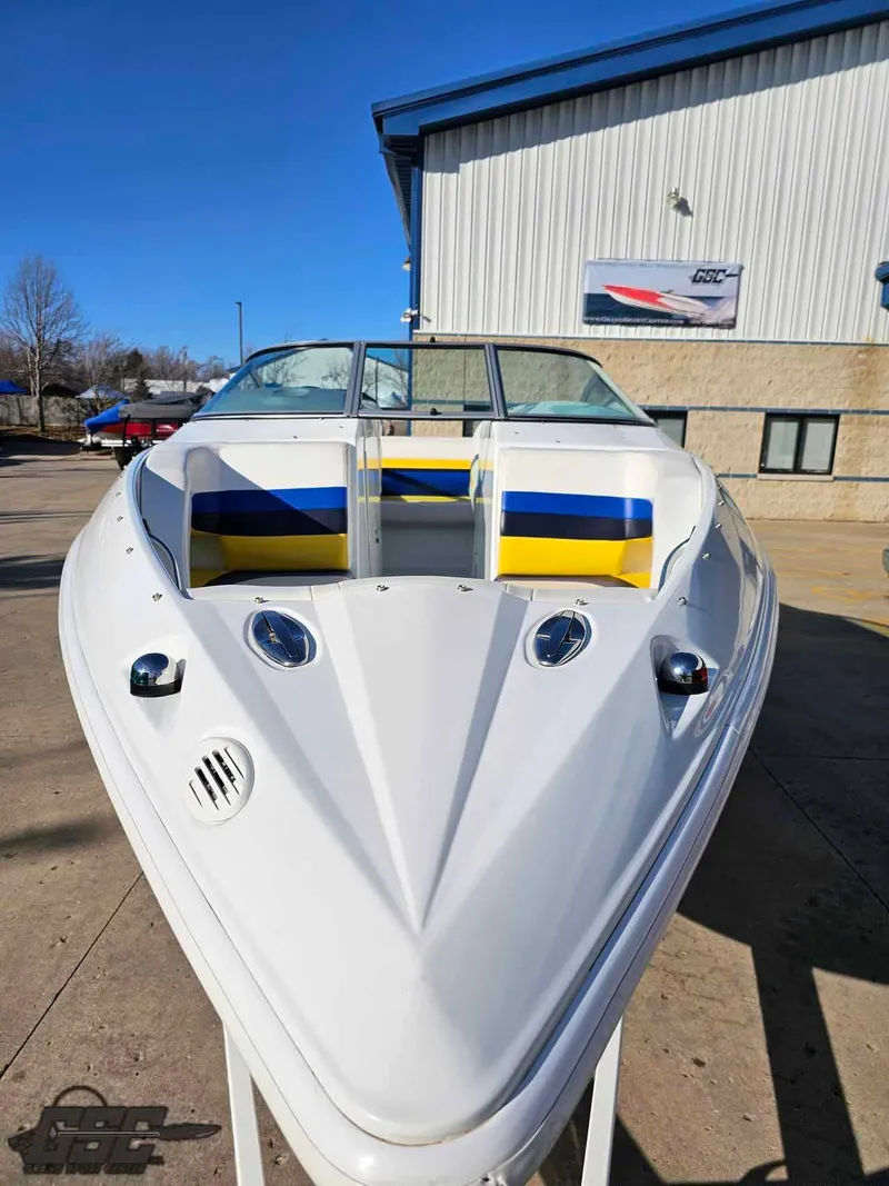 Slide: The Image of 2008 Baja 247 Islander boat with vibrant seating, parked outdoors. - 16