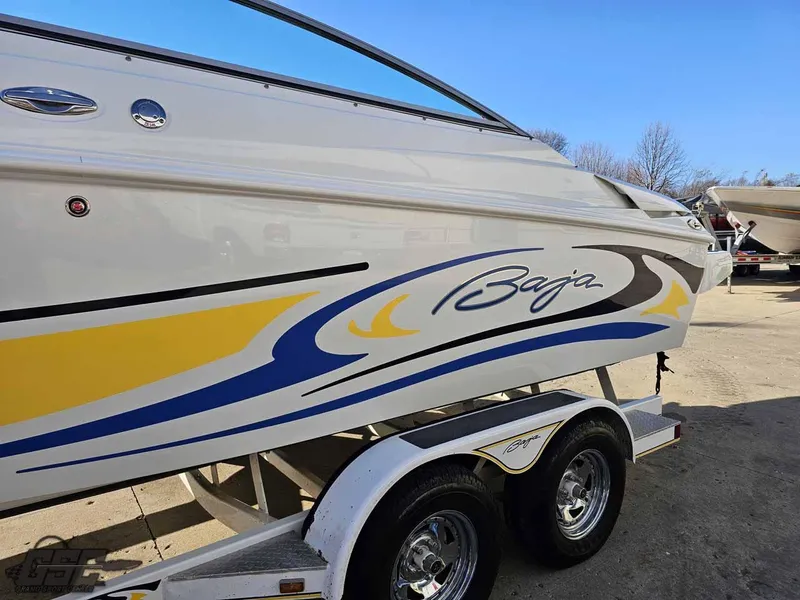 Slide: The Image of 2008 Baja 247 Islander boat on trailer with colorful graphics. - 20
