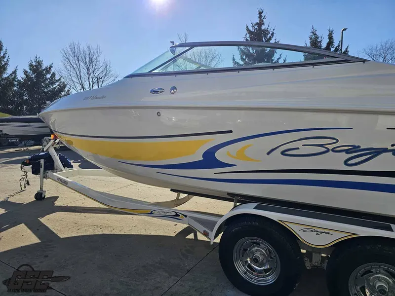 Slide: The Image of 2008 Baja 247 Islander boat on trailer, featuring sleek design and vibrant graphics. - 22