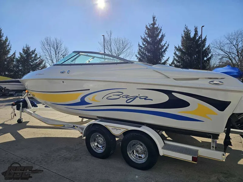 Slide: The Image of 2008 Baja 247 Islander boat on trailer, featuring sleek design and vibrant graphics. - 23