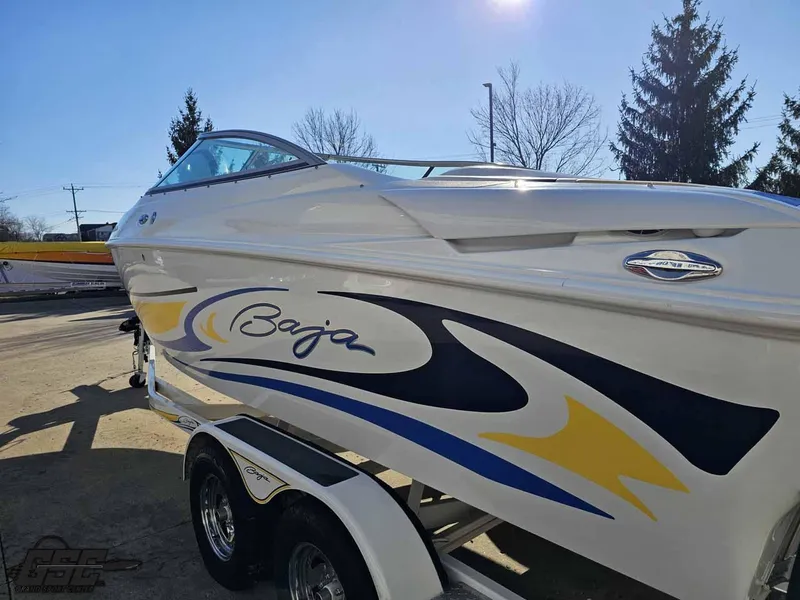 Slide: The Image of 2008 Baja 247 Islander boat on trailer, featuring sleek design and vibrant graphics. - 25