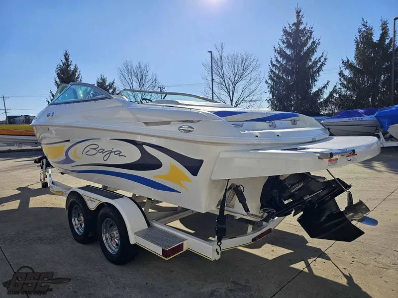 Slide: The Image of 2008 Baja 247 Islander boat on trailer, featuring sleek design and vibrant graphics. - 27