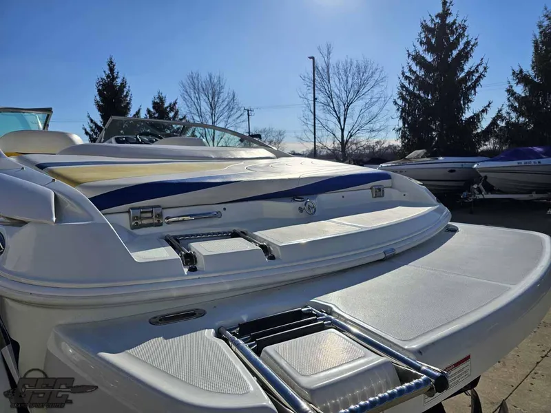 Slide: The Image of 2008 Baja 247 Islander boat with swim platform and ladder, outdoors on a sunny day. - 28