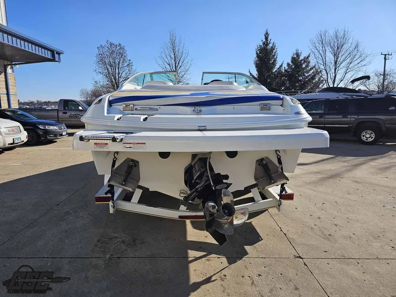 Slide: The Image of 2008 Baja 247 Islander boat, rear view, parked outdoors on a sunny day. - 29