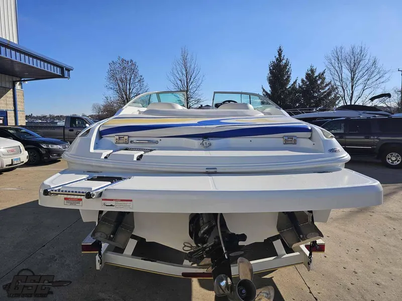 Slide: The Image of 2008 Baja 247 Islander boat, rear view, parked outdoors on a sunny day. - 30