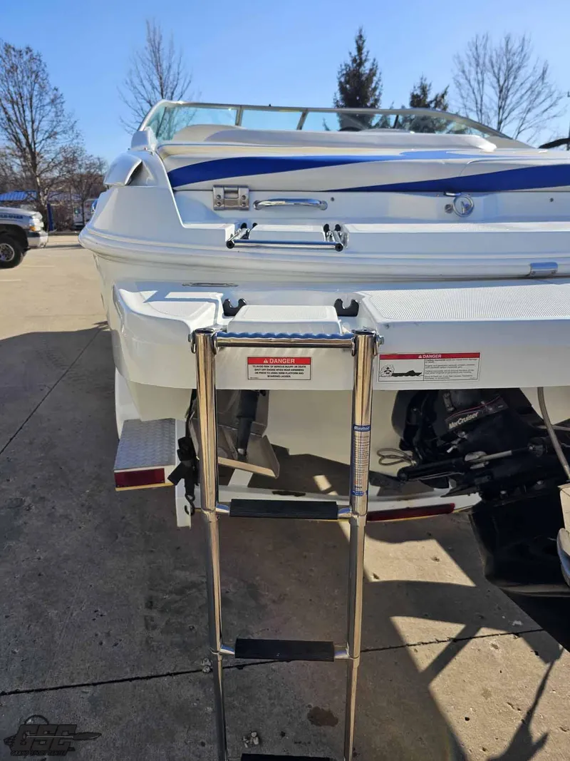 Slide: The Image of 2008 Baja 247 Islander boat with rear ladder on a sunny day. - 31