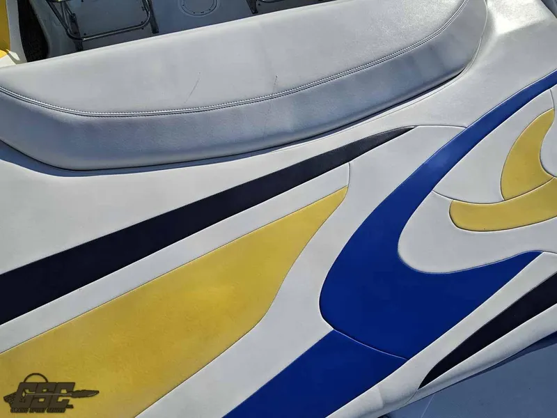 Slide: The Image of 2008 Baja 247 Islander boat seat with colorful blue, yellow, and white design. - 37