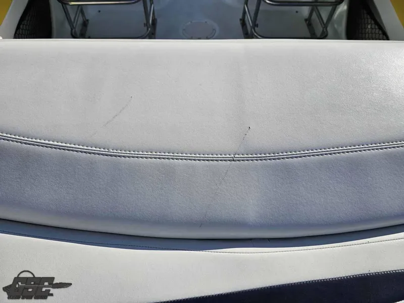 Slide: The Image of 2008 Baja 247 Islander boat seat with visible wear and stitching details. - 38