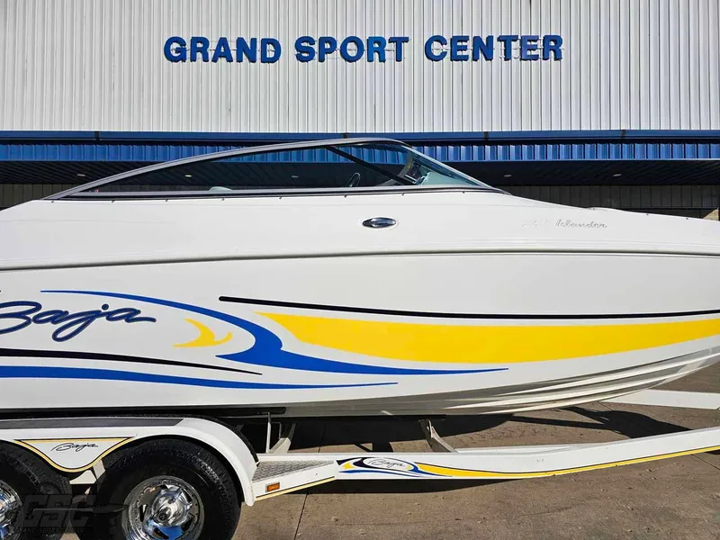 Slide: The Image of 2008 Baja 247 Islander boat with vibrant graphics at Grand Sport Center. - 4