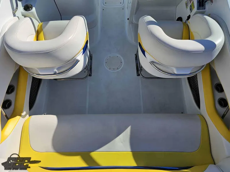 Slide: The Image of 2008 Baja 247 Islander boat interior with white and yellow seating. - 42