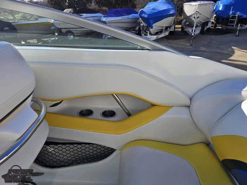 Slide: The Image of Interior of a 2008 Baja 247 Islander boat with yellow and white seating. - 44