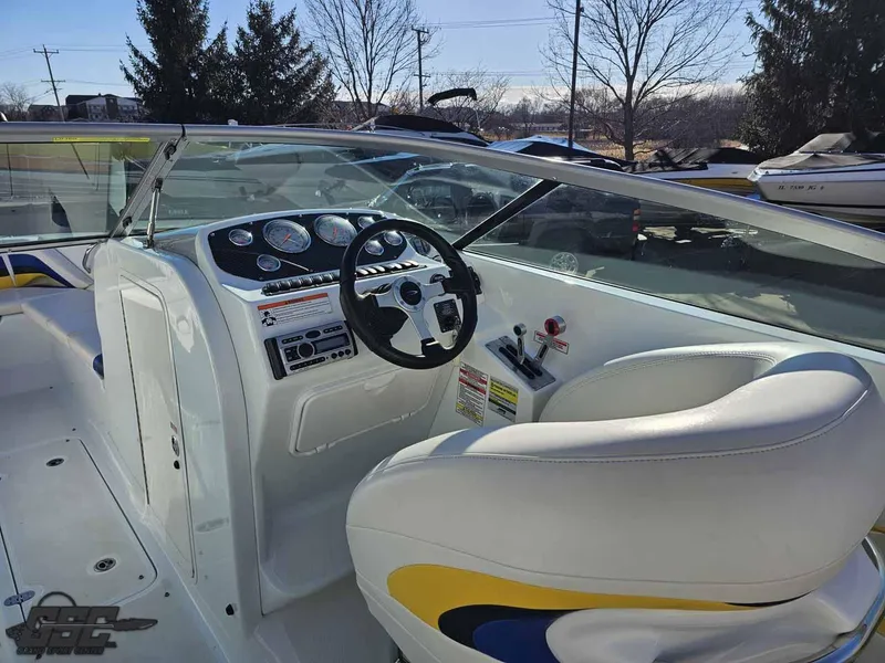 Slide: The Image of 2008 Baja 247 Islander boat interior with steering wheel and dashboard controls. - 45