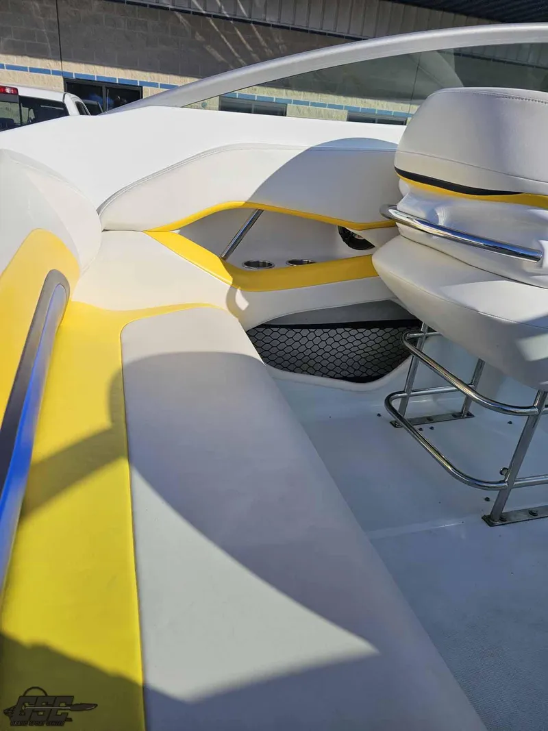 Slide: The Image of 2008 Baja 247 Islander boat interior with yellow and white seating and chrome accents. - 46