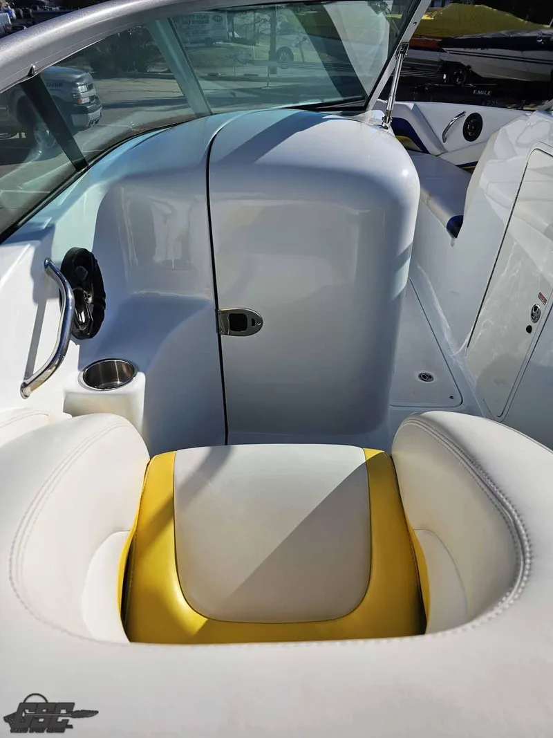 Slide: The Image of 2008 Baja 247 Islander boat interior with white and yellow seating. - 48