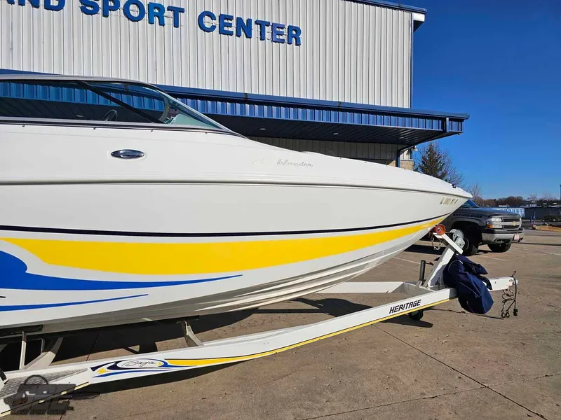 Slide: The Image of 2008 Baja 247 Islander boat with yellow and blue accents on a trailer. - 6