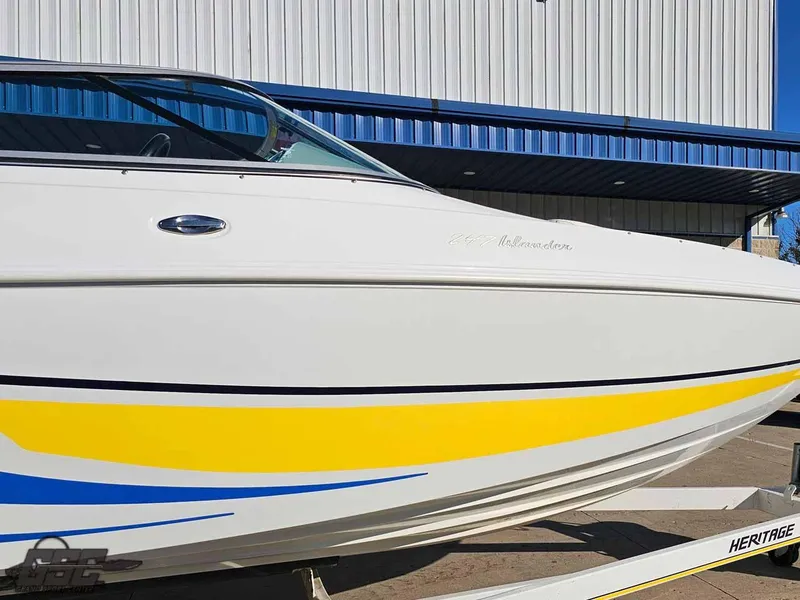 Slide: The Image of 2008 Baja 247 Islander boat with yellow and blue accents on trailer. - 7