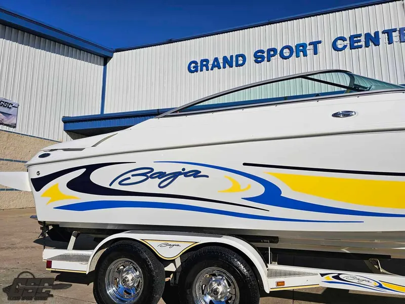 Slide: The Image of 2008 Baja 247 Islander boat with vibrant graphics at Grand Sport Center. - 8