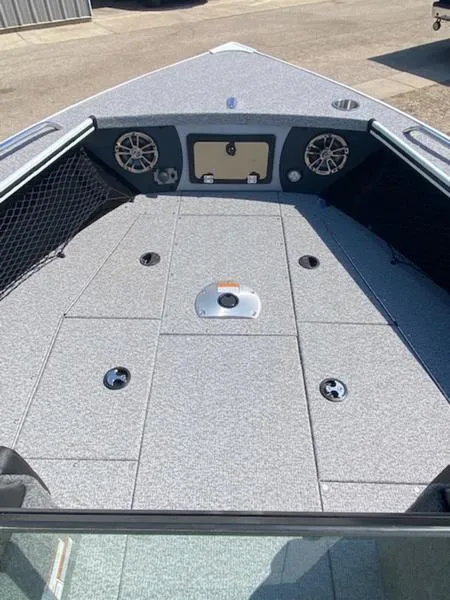 Slide: The Image of 2023 Alumacraft Trophy 185 boat deck with storage compartments and speakers. - 11