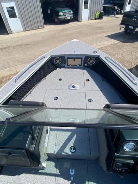 Slide: The Image of 2023 Alumacraft Trophy 185 boat interior with modern dashboard and spacious deck. - 3