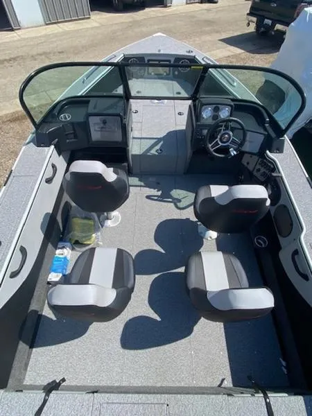 Slide: The Image of 2023 Alumacraft Trophy 185 boat interior with four seats and dashboard view. - 4