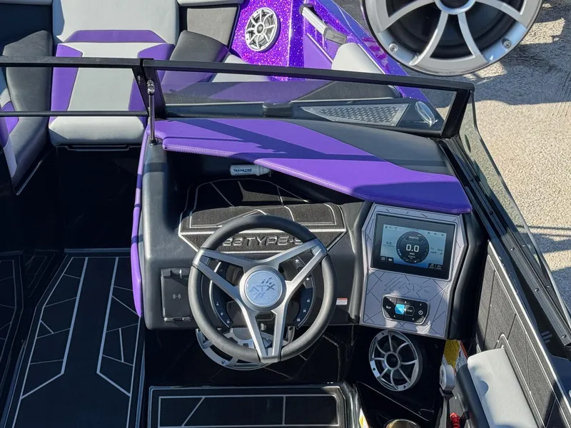 Slide: The Image of 2025 ATX Surf Boats 22 Type-S interior with purple accents and modern dashboard. - 10