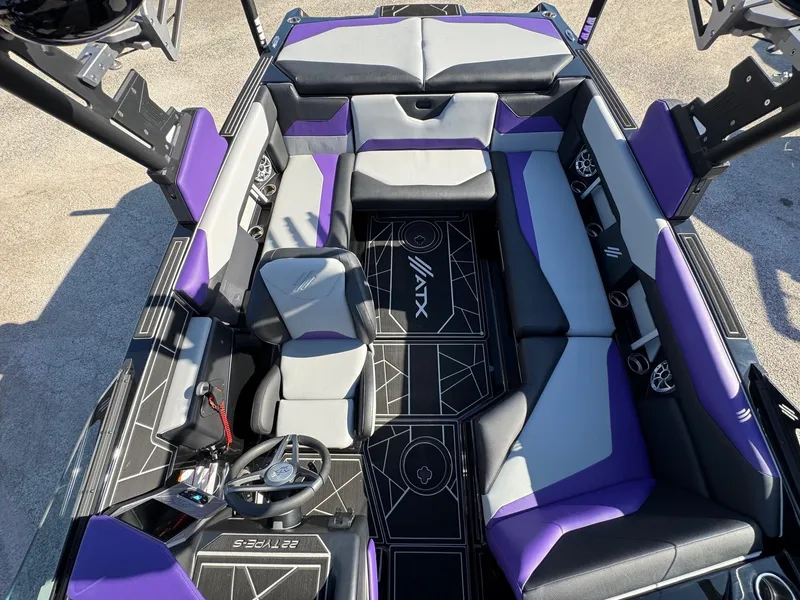 Slide: The Image of 2025 ATX Surf Boats 22 Type-S interior with purple and gray seating, modern design. - 13