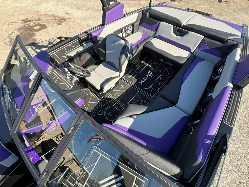Slide: The Image of 2025 ATX Surf Boats 22 Type-S interior with purple and gray seating, modern design. - 15