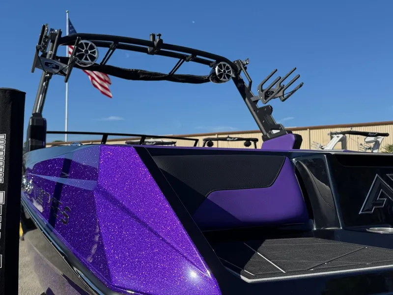 Slide: The Image of 2025 ATX Surf Boats 22 Type-S with vibrant purple finish and wakeboard tower. - 6