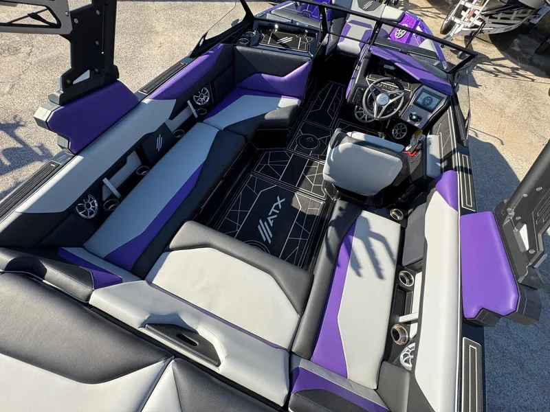 Slide: The Image of 2025 ATX Surf Boats 22 Type-S interior with purple and gray seating, modern dashboard. - 9