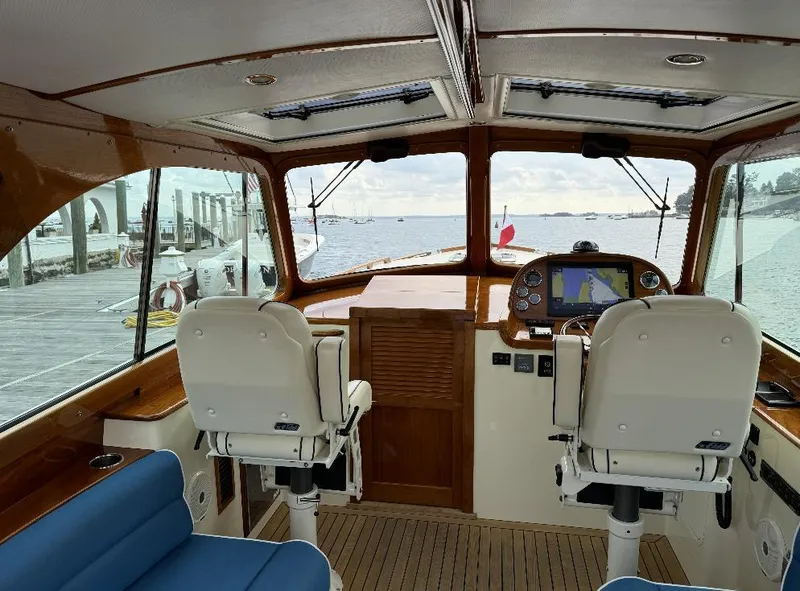 Slide: The Image of Interior view of 2018 Hinckley Picnic Boat 37 MKIII, featuring helm and seating area. - 16