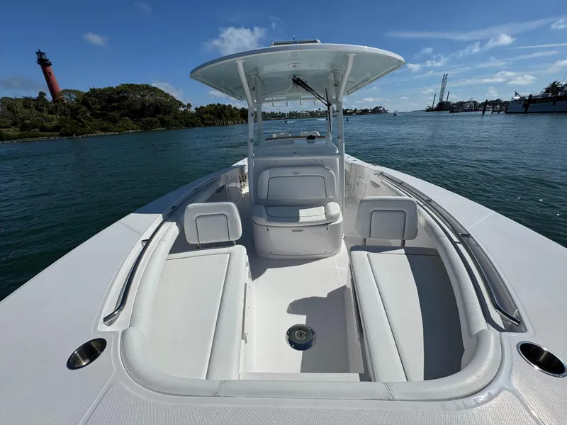 Slide: The Image of 2024 Southport 30 FE boat with spacious seating, cruising on a sunny day. - 14