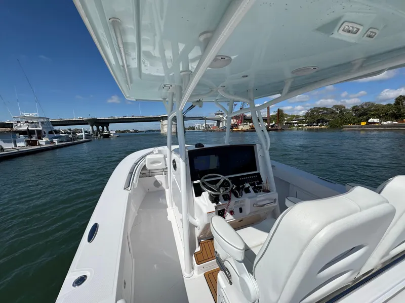 Slide: The Image of 2024 Southport 30 FE boat on water, featuring sleek design and modern controls. - 15