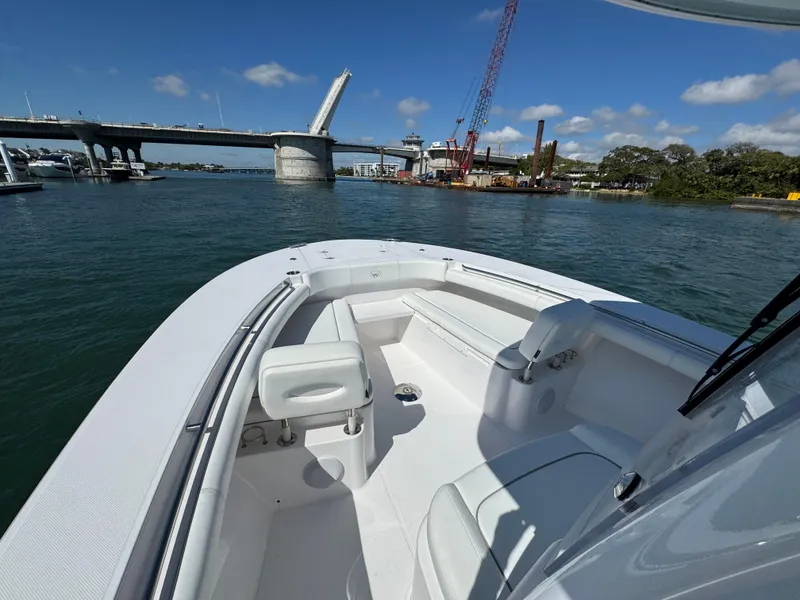 Slide: The Image of 2024 Southport 30 FE boat on water near a bridge, sunny day. - 21