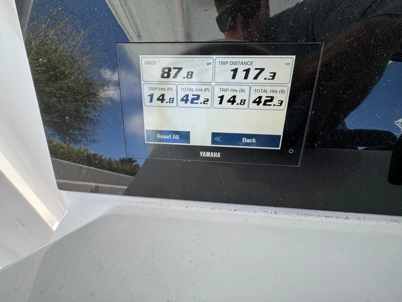 Slide: The Image of Yamaha display on 2024 Southport 30 FE showing fuel usage and trip distance. - 27