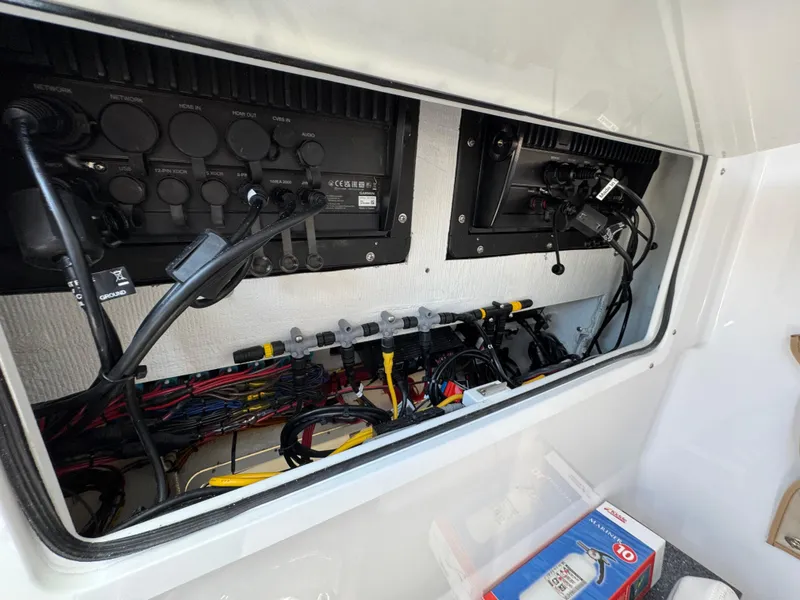 Slide: The Image of Electrical panel of 2024 Southport 30 FE boat with wiring and components. - 28