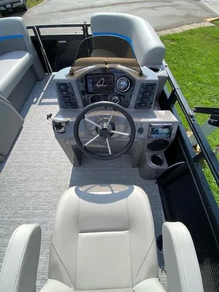 Slide: The Image of 2024 Qwest E814 CTR Cruise L boat interior with steering wheel and dashboard controls. - 6