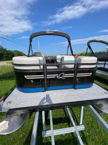 Slide: The Image of 2024 Qwest E814 CTR Cruise L pontoon boat on display under blue sky. - 7