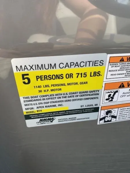 Slide: The Image of 2024 Qwest E814 CTR Cruise L capacity label: 5 persons or 715 lbs, 30 HP motor. - 8