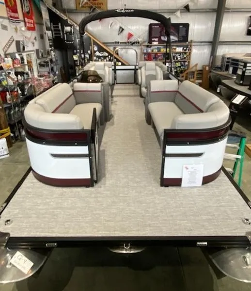 Slide: The Image of 2023 Qwest 824 E-Class RLS Triple Tube LTZ pontoon boat in showroom. - 3