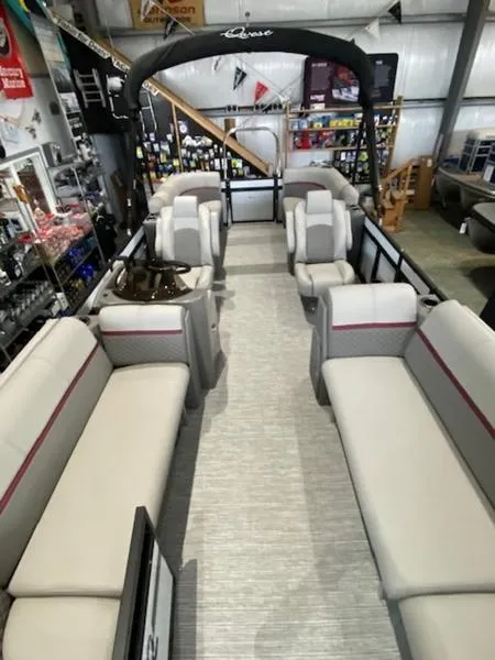 Slide: The Image of 2023 Qwest 824 E-Class RLS Triple Tube LTZ pontoon boat interior in showroom. - 5