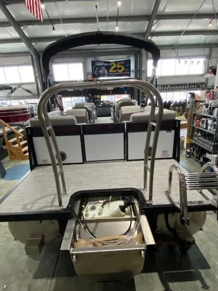 Slide: The Image of 2023 Qwest 824 E-Class RLS boat interior with Garmin steering system and modern controls. - 8