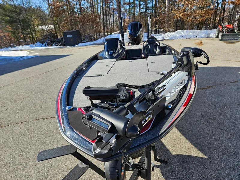Slide: The Image of 2025 Skeeter ZXR21 fishing boat with advanced trolling motor, parked outdoors. - 10