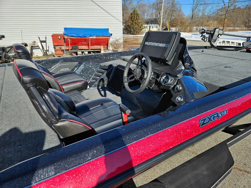 Slide: The Image of 2025 Skeeter ZXR21 boat interior with steering wheel and seats. - 4