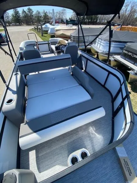 Slide: The Image of 2023 Qwest 824 E-Class Splash Pad Rw LTZ pontoon boat interior with seating and canopy. - 10