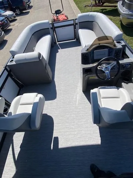 Slide: The Image of 2023 Qwest 824 E-Class Splash Pad Rw LTZ pontoon boat interior with seating and steering console. - 3