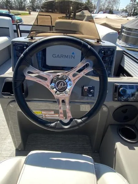 Slide: The Image of Steering wheel of 2023 Qwest 824 E-Class Splash Pad Rw LTZ with Garmin display. - 5