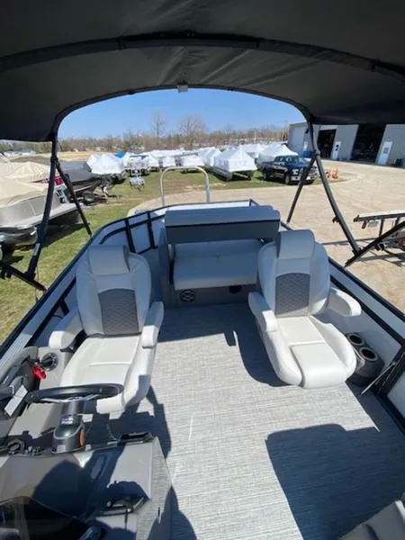 Slide: The Image of 2023 Qwest 824 E-Class Splash Pad Rw LTZ pontoon boat interior with seating and canopy. - 6