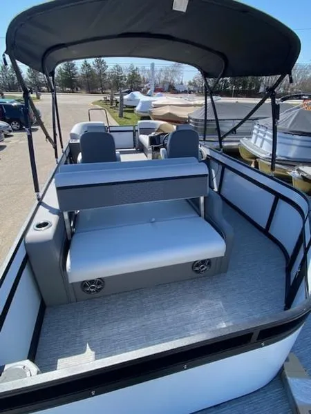 Slide: The Image of 2023 Qwest 824 E-Class Splash Pad Rw LTZ pontoon boat with spacious seating and canopy. - 7